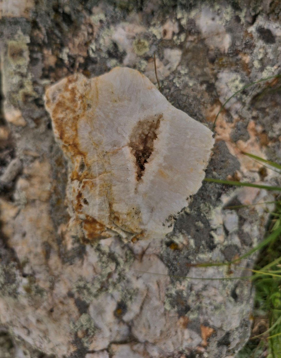 Vuggy vein quartz slab, hammer for scale