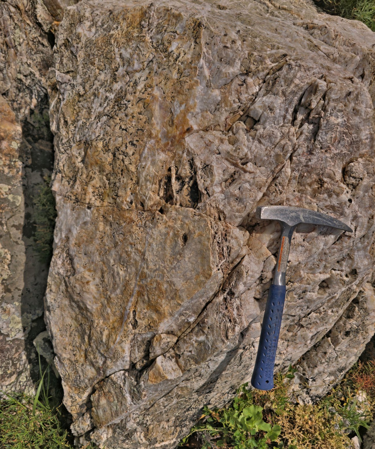 Main vein face, vuggy and ribboned quartz, hammer for scale